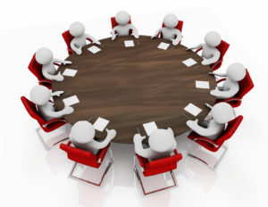 Overhead view of 3d cartoon characters holding a business meeting seated around a round table